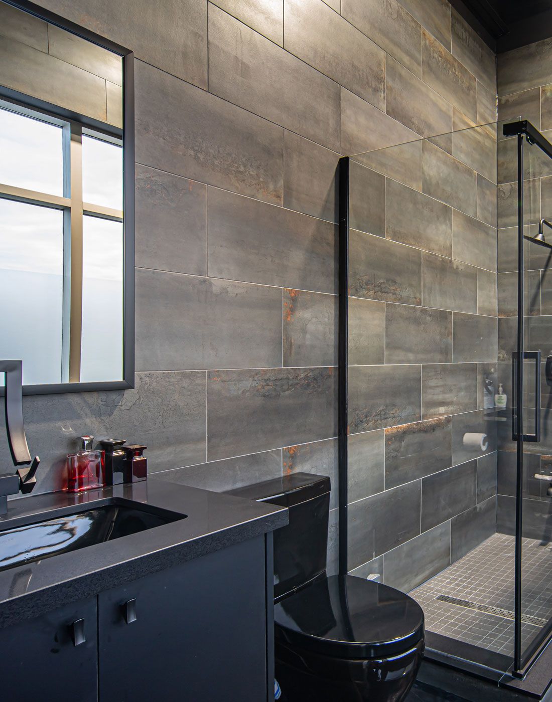 Industrial Modern Bathroom with Dark Tiling and Fixtures