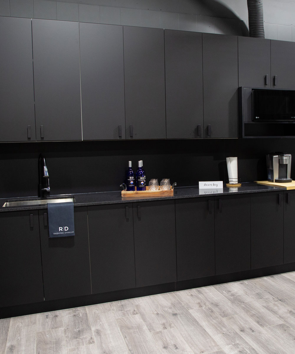 Sleek Commercial Kitchenette with Black Cabinetry