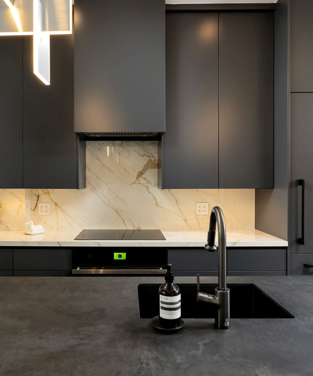 Contemporary Matte Black Kitchen with Marble Backsplash