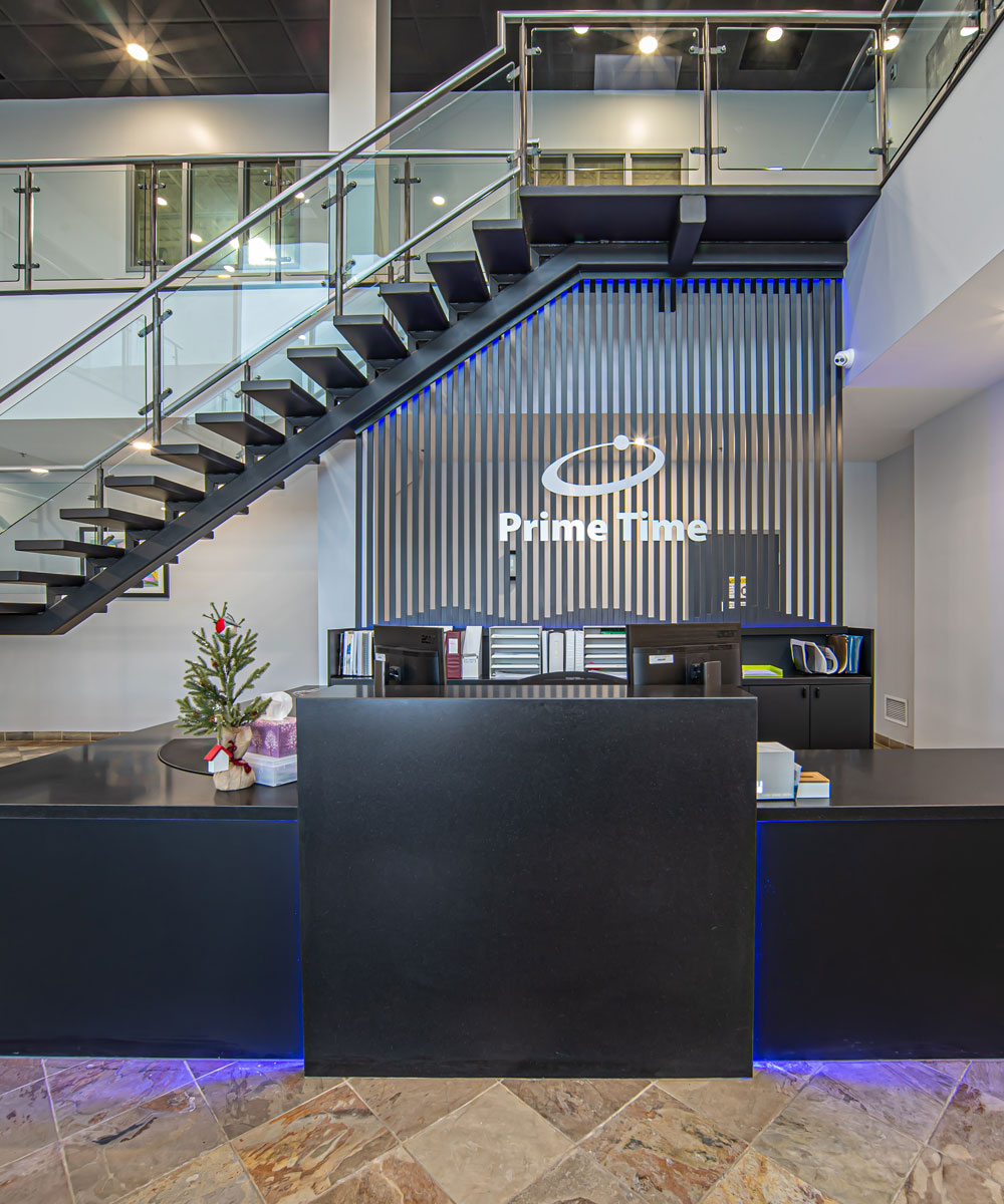 Modern Commercial Reception with Floating Staircase