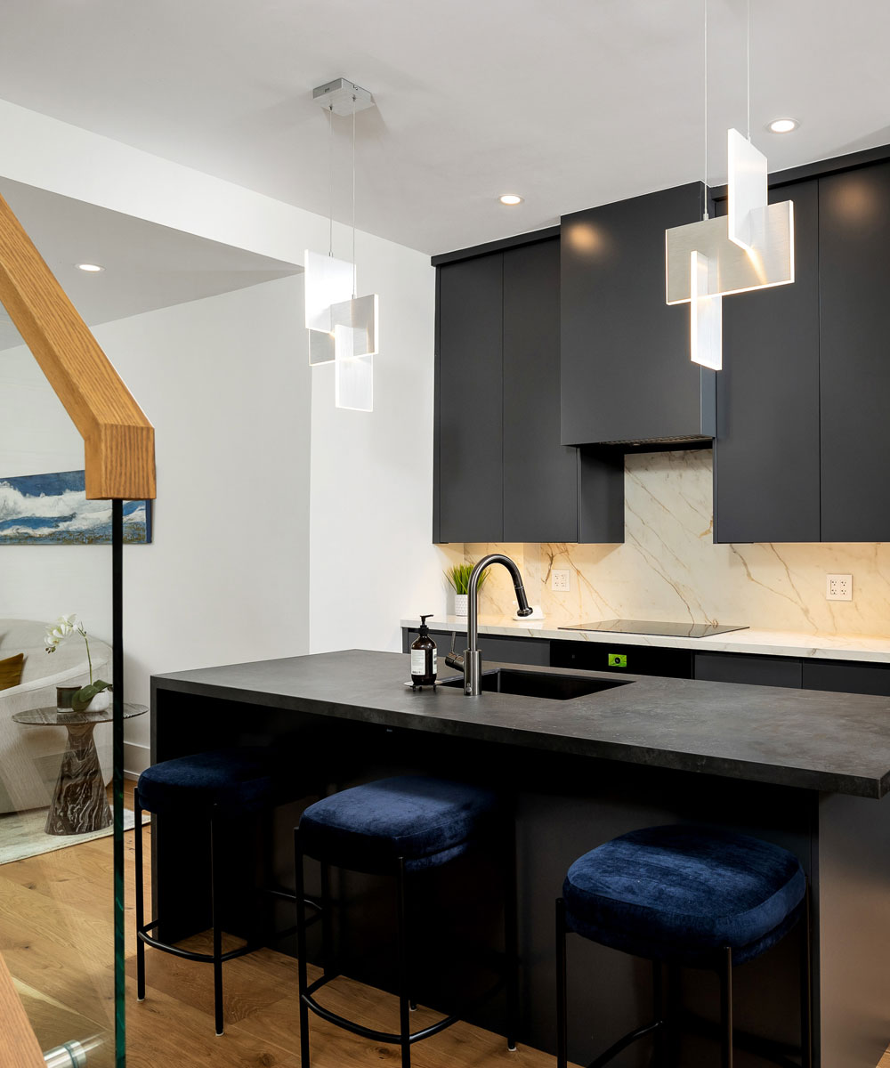 Contemporary Black Kitchen with Marble Backsplash