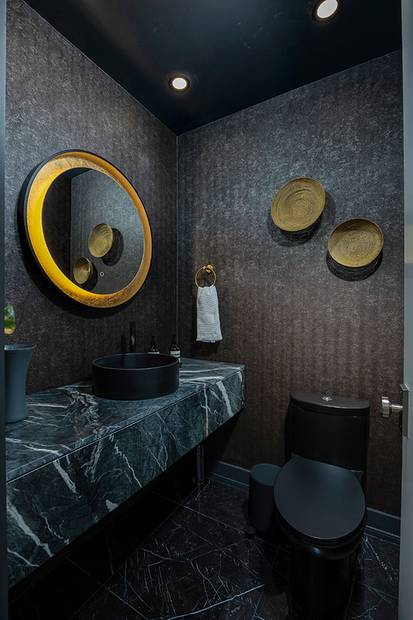 Dramatic Dark Powder Room with Marble Vanity