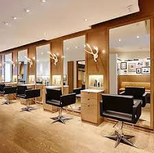 Modern Hair Salon with Wood Paneling and Large Mirrors