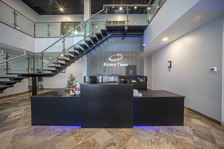 Modern Commercial Lobby with Floating Staircase & Reception