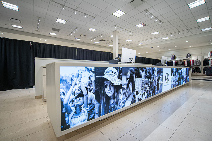 Vibrant Retail Checkout Counter with Illuminated Graphics