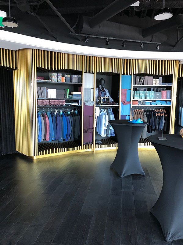 Modern Retail Showroom with Gold Slat Walls
