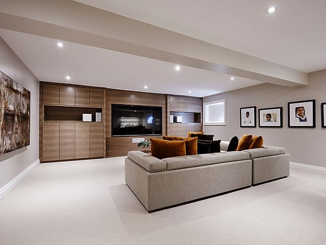 Modern Media Room with Integrated Walnut Cabinetry