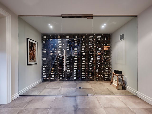 Contemporary Glass Wine Cellar with Metal Racking