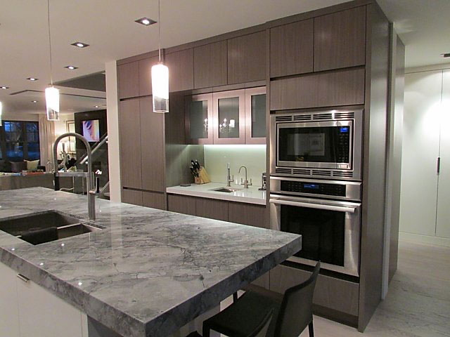 Contemporary Kitchen with Gray Wood Cabinets & Marble Island
