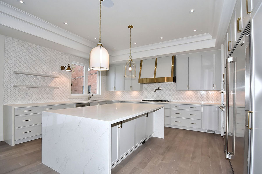 Modern Gray Kitchen with Quartz Island and Brass Accents