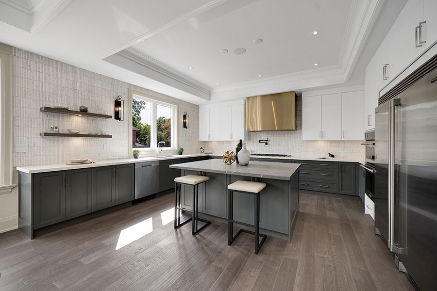 Modern Bi-Tone Kitchen with Gold Hood & Tray Ceiling