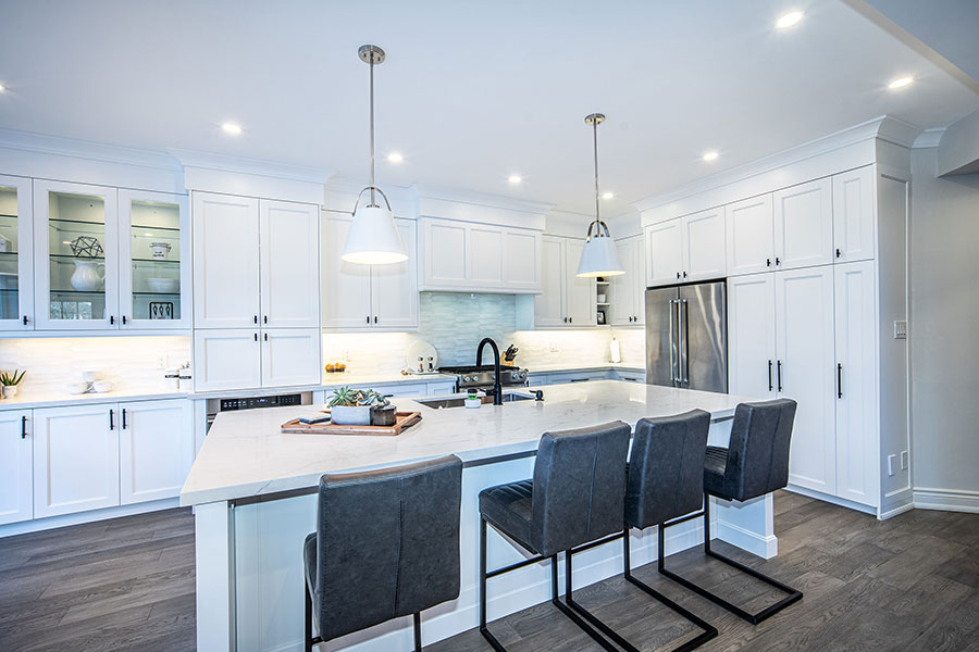 Contemporary White Kitchen with Large Waterfall Island