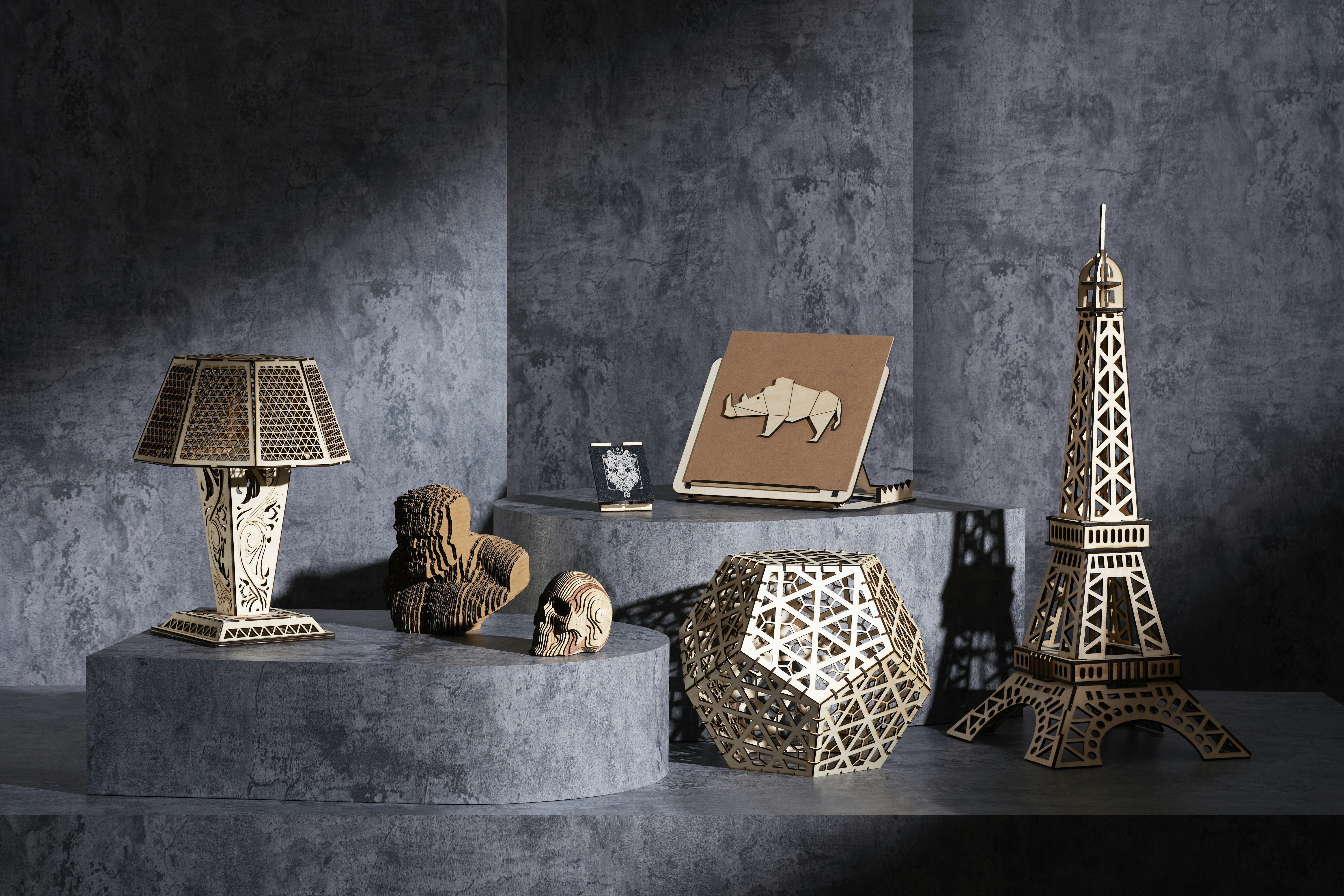 Intricate Laser-Cut Wood Decor on Textured Podiums