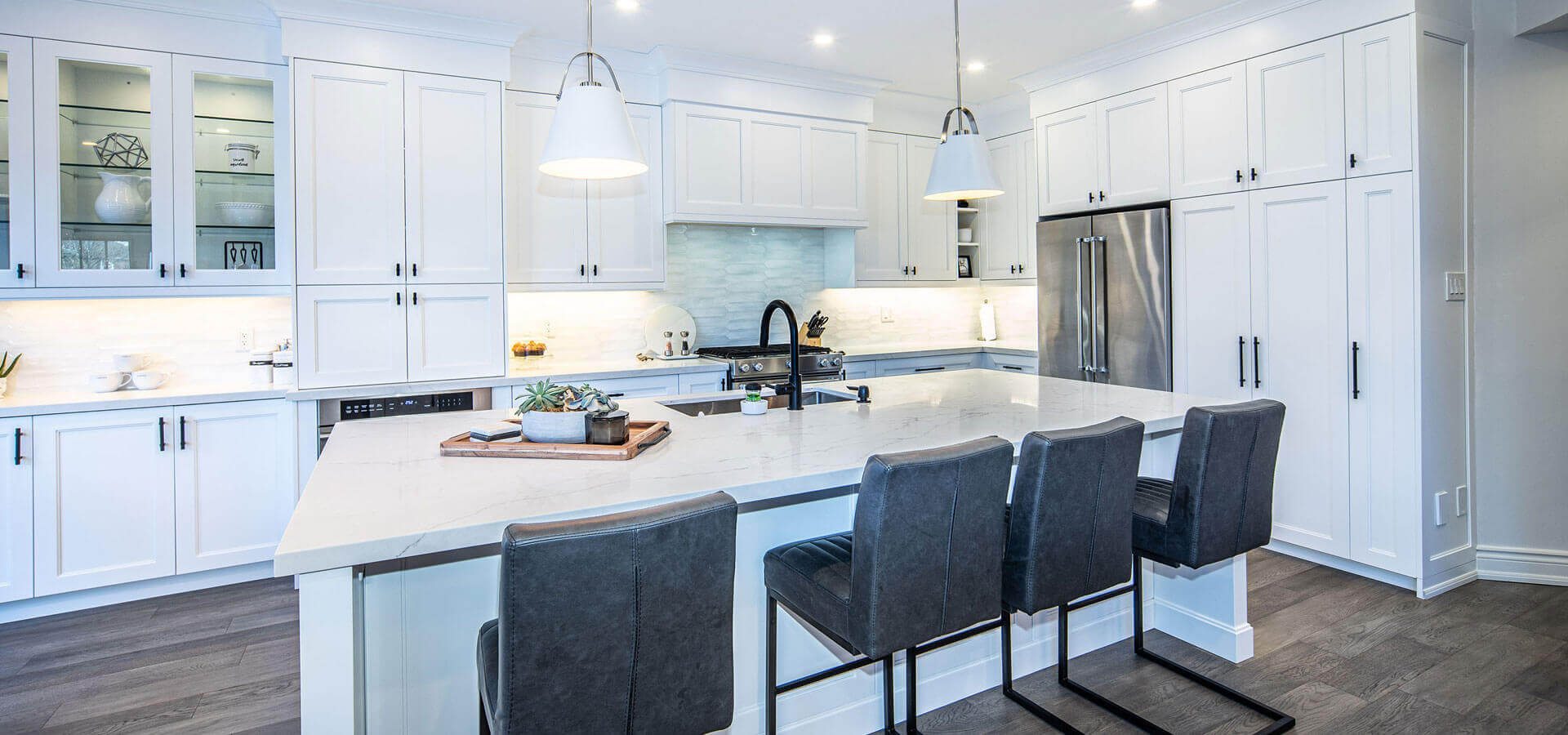 Modern White Kitchen with Peninsula and Black Accents